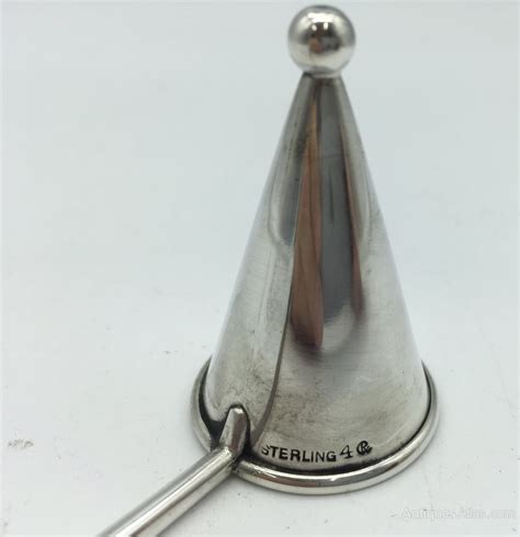 Antique Sterling Silver Candle Snuffer .